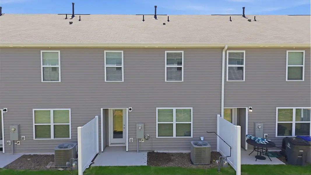 Exterior details and patio area of a home in The Townes at Hunter Hill, Rocky Mount (Image 4).