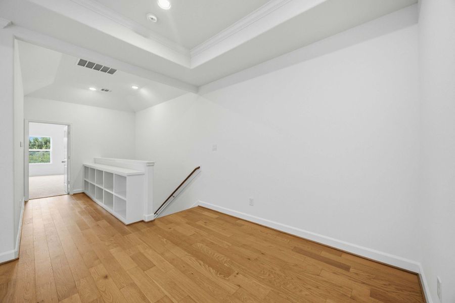 Stroll past built-in bookshelves leading to the Owner's Retreat, merging function with style.