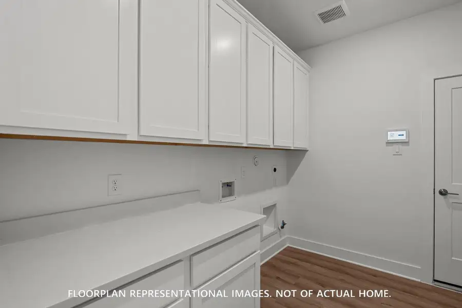 Furnished interior view inside a new home in The Oaks on 6th Street, Magnolia (Image 13).