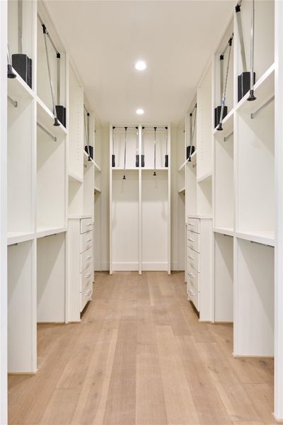 Spacious walk-in primary closet offering ample storage. Spacious walk-in primary closet offering ample storage.