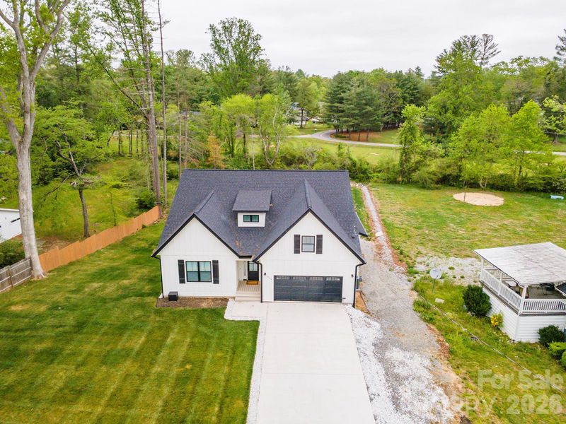 Front exterior of a new home in , Hendersonville, NC, highlighting curb appeal (Image 25).