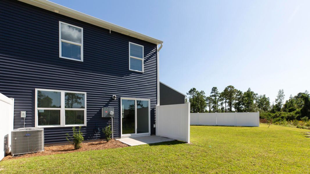 Front exterior of a new home in Grayson Park Townhomes, Leland, NC, highlighting curb appeal (Image 2).