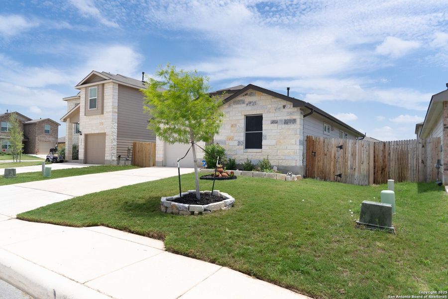 Front exterior of a new home in Whisper Falls, San Antonio, TX, highlighting curb appeal (Image 17). Front exterior of a new home in Whisper Falls, San Antonio, TX, highlighting curb appeal (Image 17).