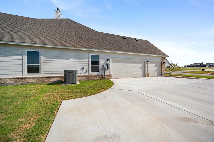 Front exterior of a new home in Fairview Meadows, New Fairview, TX, highlighting curb appeal (Image 16). Front exterior of a new home in Fairview Meadows, New Fairview, TX, highlighting curb appeal (Image 16).