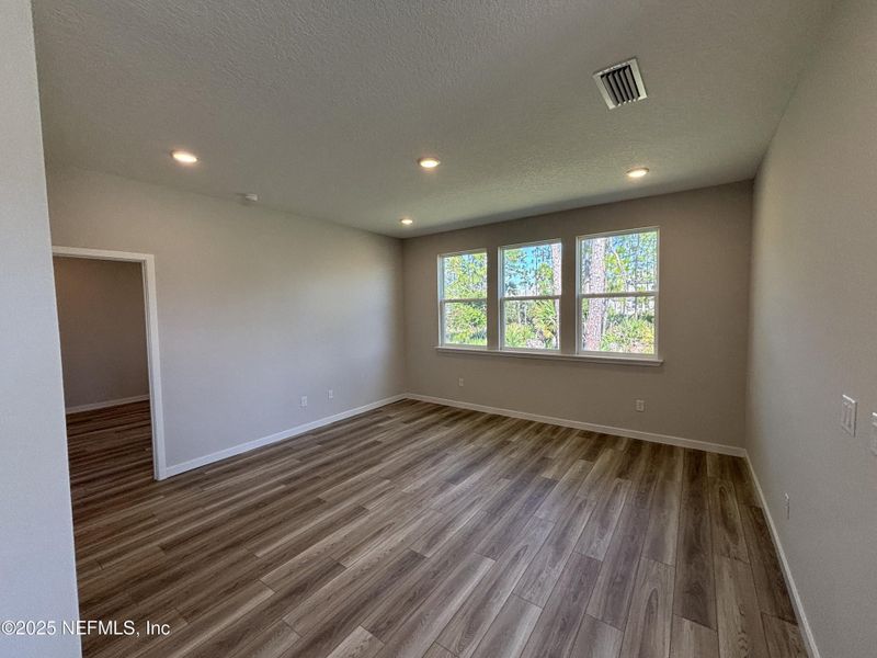 Spacious, unfurnished interior of a new home in The Magnolia Series at Reserve East, Flagler Beach (Image 24).