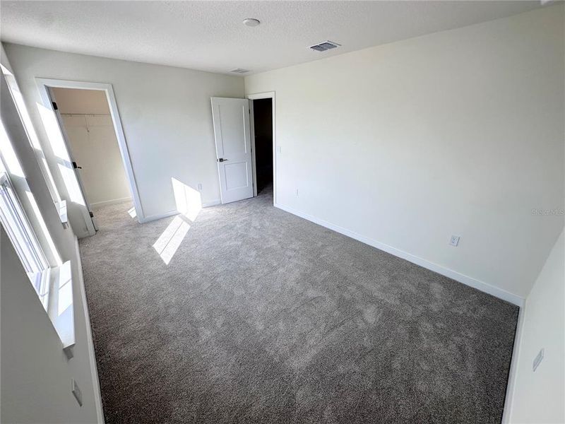 Spacious, unfurnished interior of a new home in Grasslands West, Lakeland (Image 15).