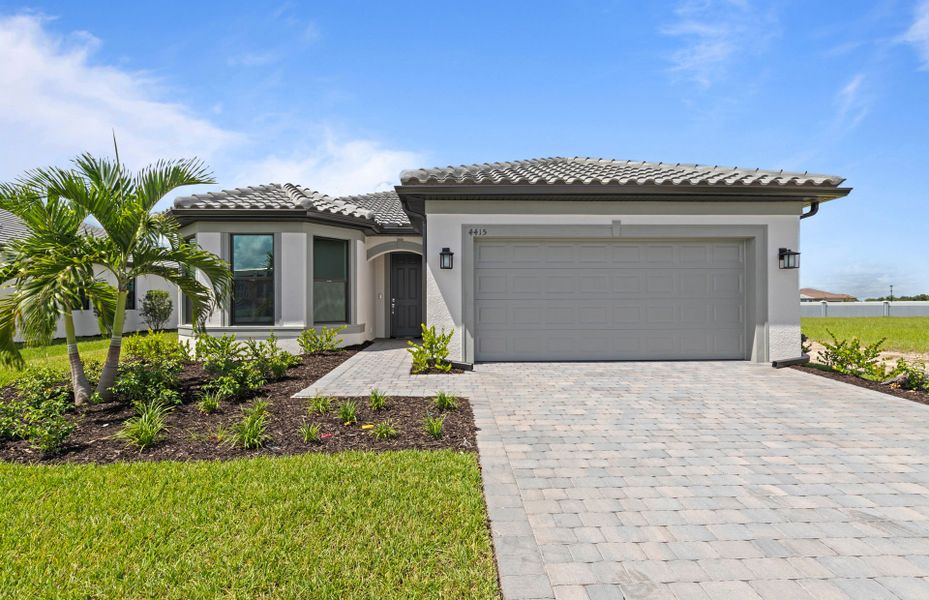 Front exterior of a new home in Arbor Oaks, North Port, FL, highlighting curb appeal (Image 2). Front exterior of a new home in Arbor Oaks, North Port, FL, highlighting curb appeal (Image 2).