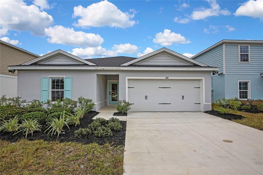 Front exterior of a new home in , Sumterville, FL, highlighting curb appeal (Image 32).