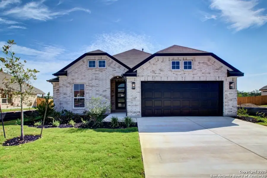 Front exterior of a new home in Veranda, San Antonio, TX, highlighting curb appeal (Image 1).