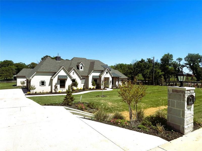 Front exterior of a new home in , Argyle, TX, highlighting curb appeal (Image 21).