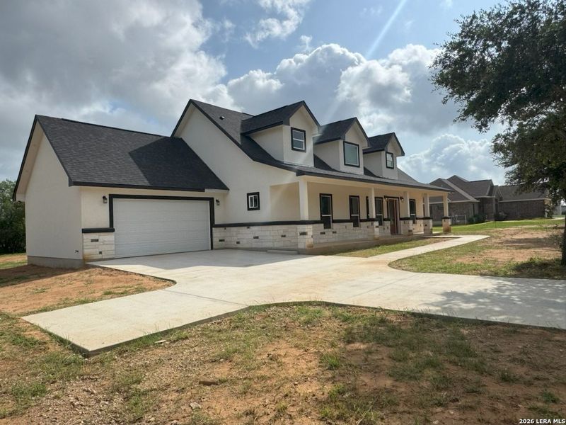 Front exterior of a new home in , Lytle, TX, highlighting curb appeal (Image 1). Front exterior of a new home in , Lytle, TX, highlighting curb appeal (Image 1).