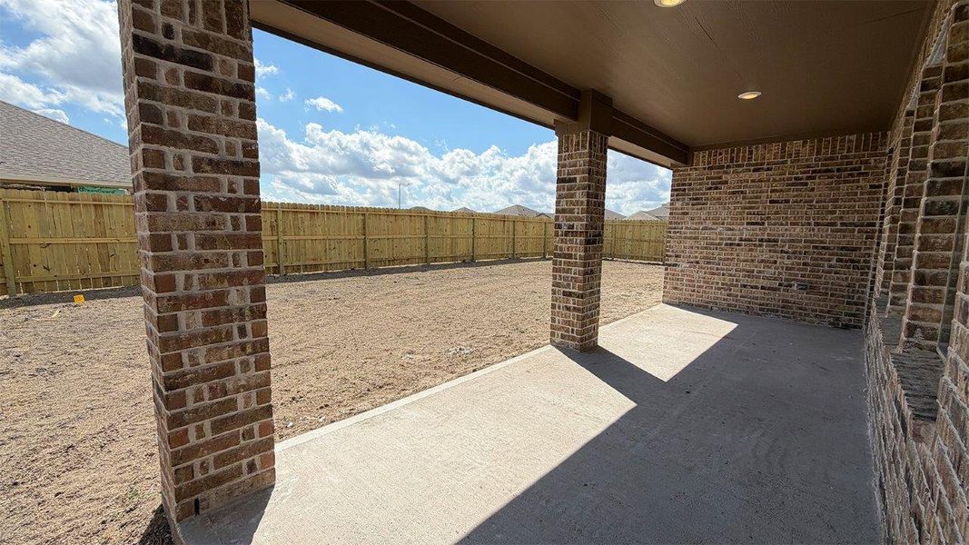 Exterior details and patio area of a home in The Lakes Northwest, Robstown (Image 17).