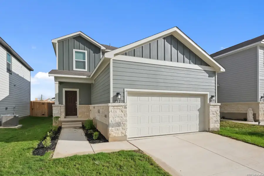 Front exterior of a new home in Applewhite Meadows, San Antonio, TX, highlighting curb appeal (Image 1). Front exterior of a new home in Applewhite Meadows, San Antonio, TX, highlighting curb appeal (Image 1).