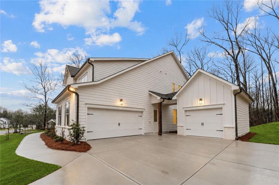 Front exterior of a new home in The Reserve at Knollwood, Canton, GA, highlighting curb appeal (Image 18).