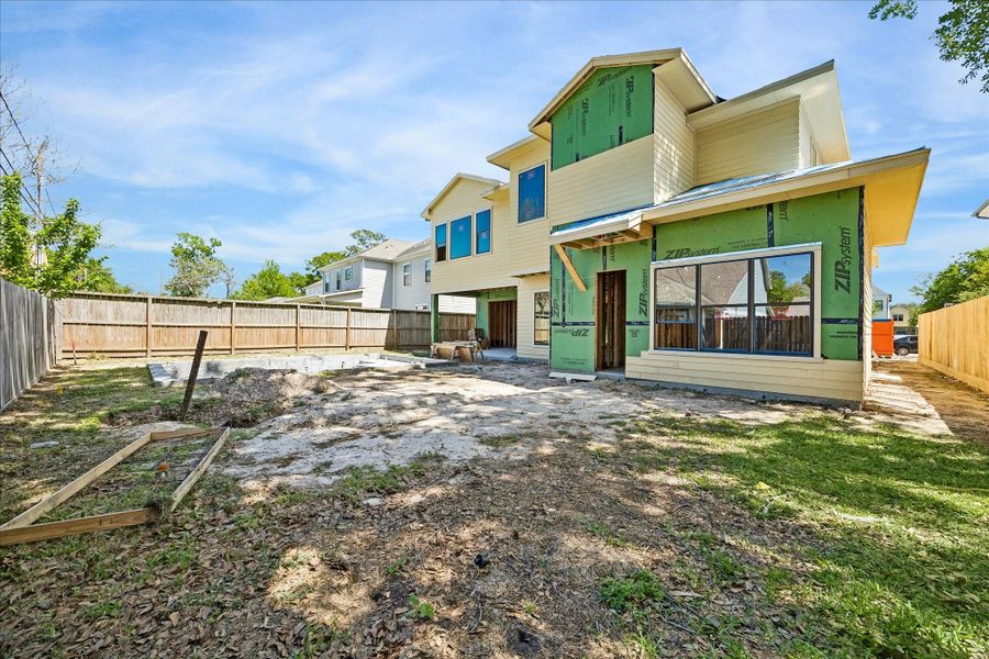 A covered veranda and the professionally designed pool transform the backyard into a private retreat perfect for year-round enjoyment. *Current construction 4/7/26
