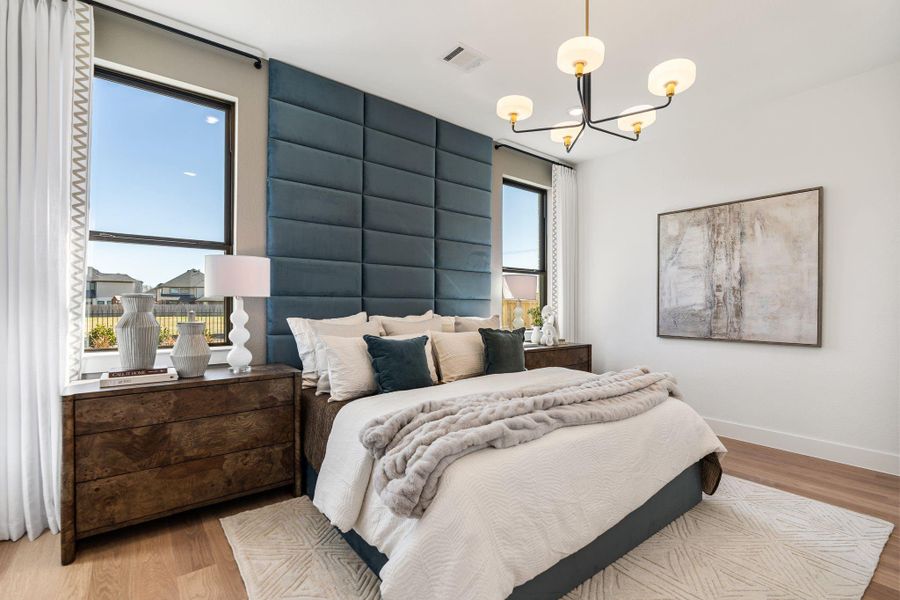 Soft designer lighting, and expansive windows that bathe the space in natural light