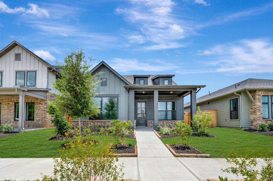 Front exterior of a new home in Sienna - Landmark Row Collection, Missouri City, TX, highlighting curb appeal (Image 26). Front exterior of a new home in Sienna - Landmark Row Collection, Missouri City, TX, highlighting curb appeal (Image 26).