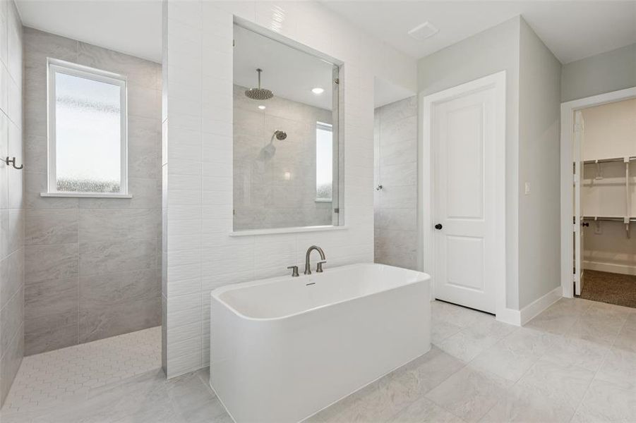This dream owner's bath features our signature double walk through shower with free standing tub! This dream owner's bath features our signature double walk through shower with free standing tub!