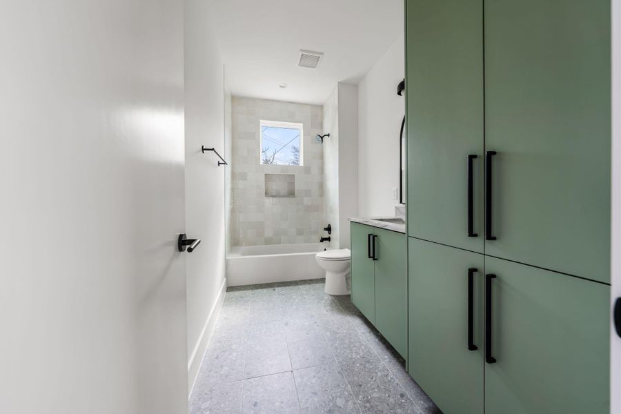 Ensuite bathroom with built in cabinetry