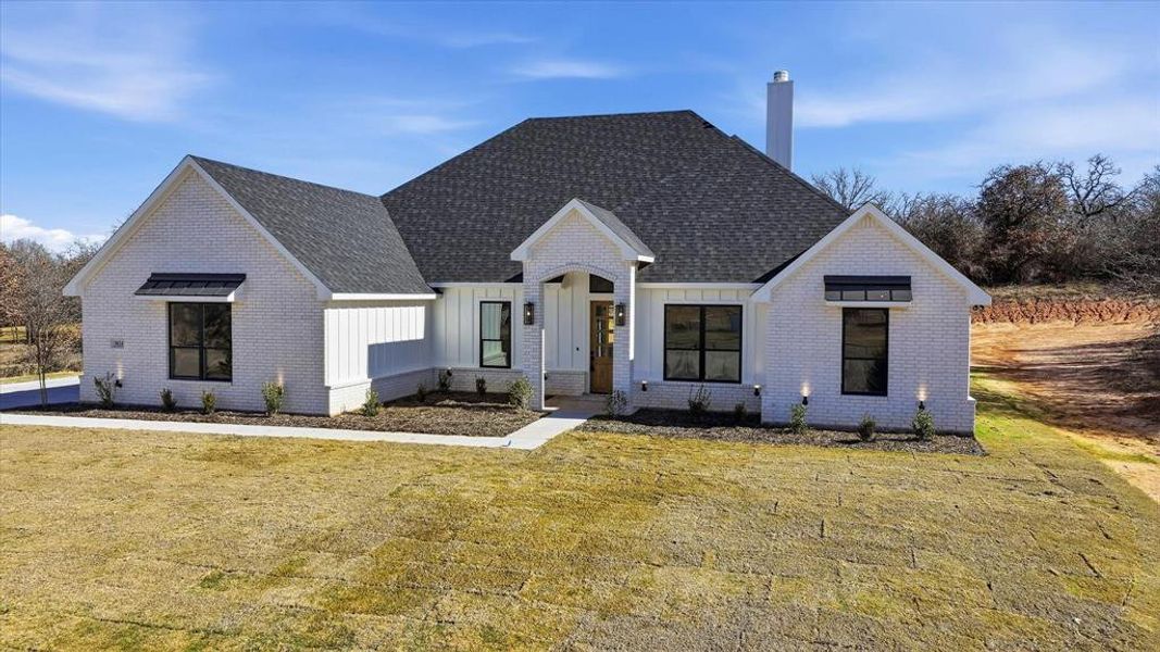 Front exterior of a new home in , Peaster, TX, highlighting curb appeal (Image 21).