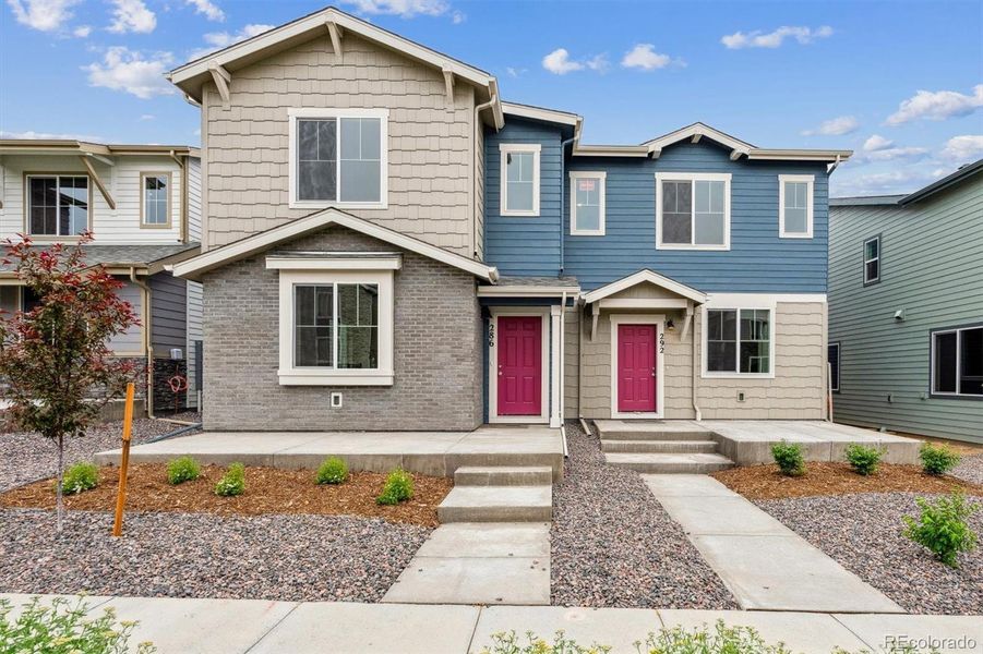 Front exterior of a new home in Pintail Commons at Johnstown Village, Johnstown, CO, highlighting curb appeal (Image 2).
