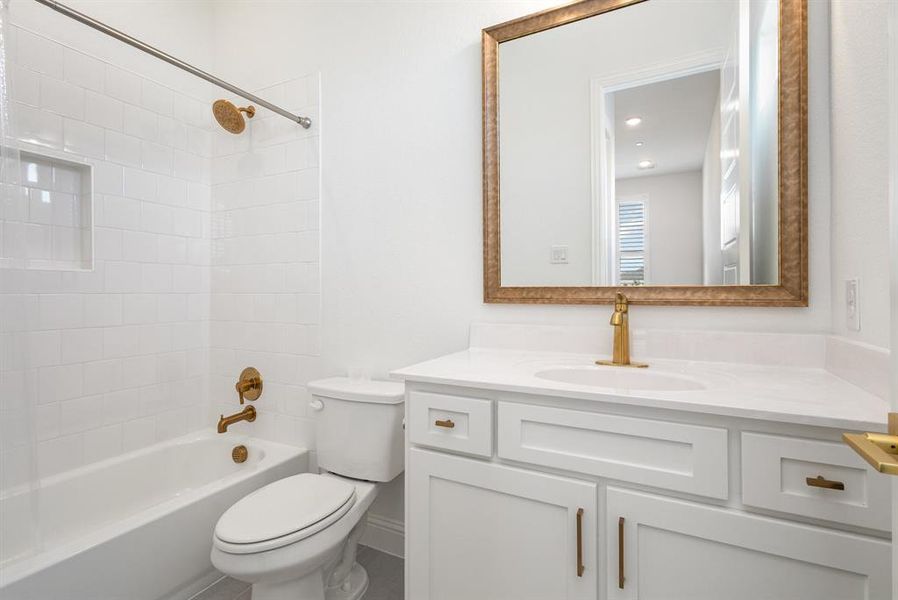 Bathroom featuring  shower combination and vanity