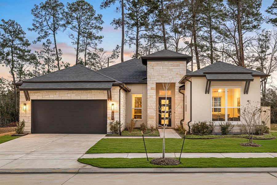 Front exterior of a new home in Audubon 60’s, Magnolia, TX, highlighting curb appeal (Image 2).