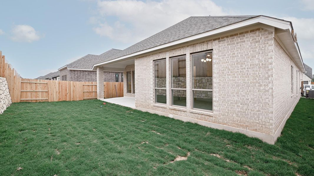 Exterior details and patio area of a home in Crosswinds, Kyle (Image 13).