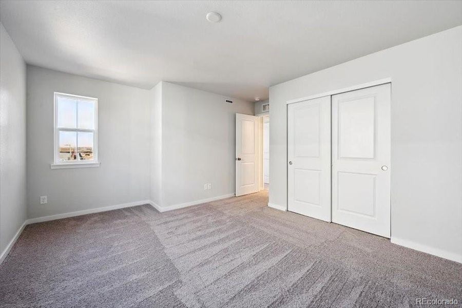 Spacious, unfurnished interior of a new home in The Boulevard II Collection at Windler, Aurora (Image 12).