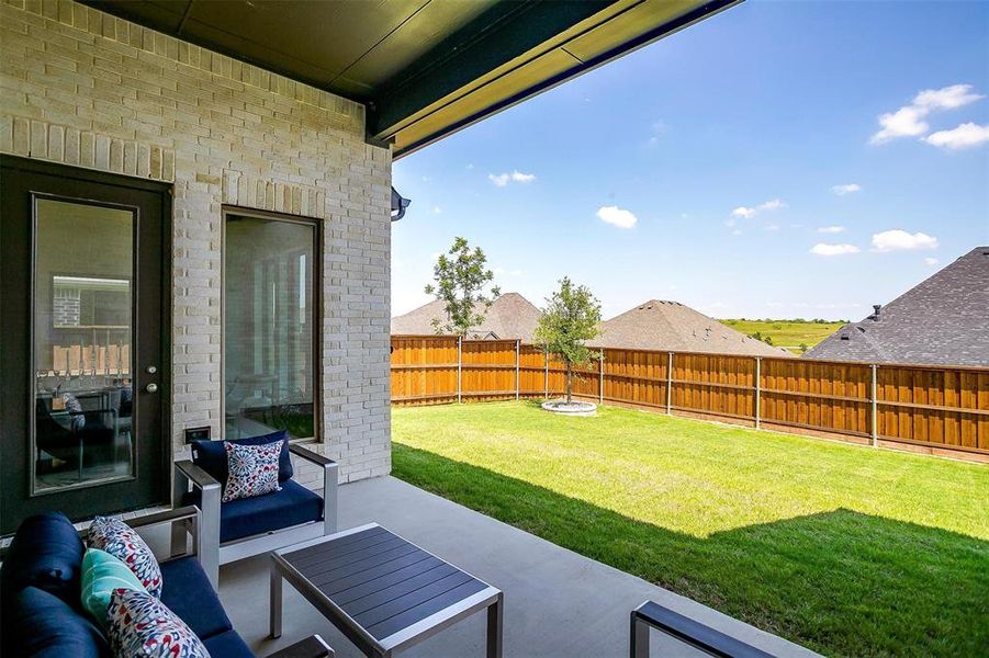 View of yard featuring an outdoor living space and a patio View of yard featuring an outdoor living space and a patio