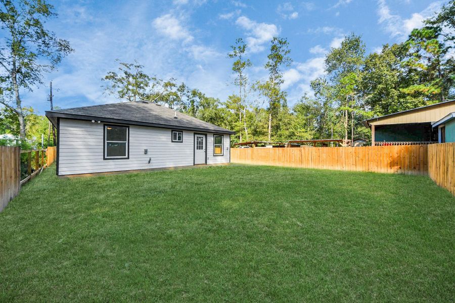Exterior details and patio area of a home in , Splendora (Image 10).