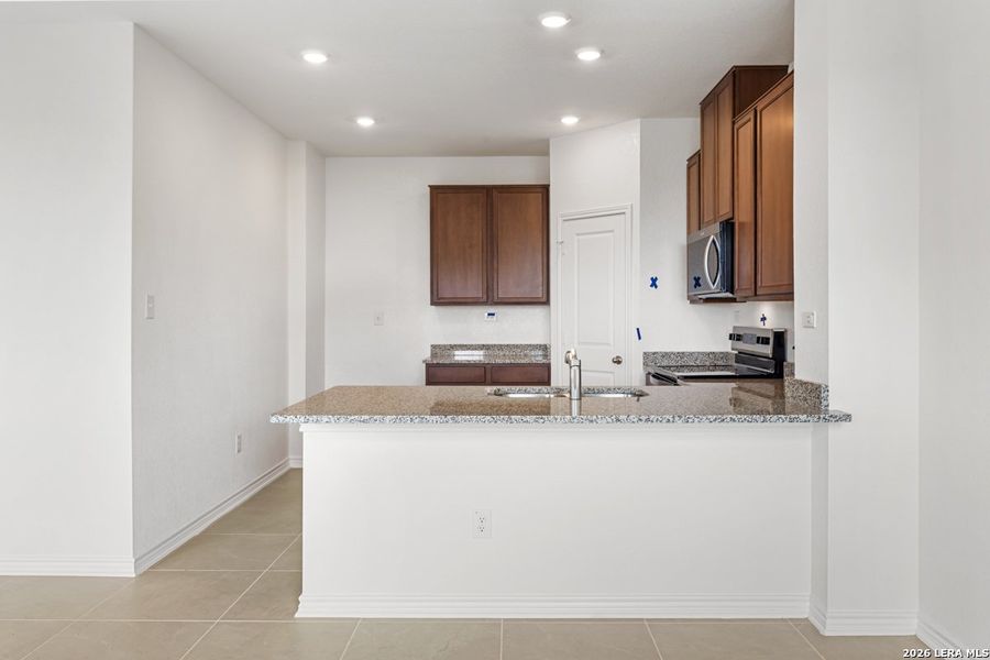 Furnished interior view inside a new home in Southton Cove, Elmendorf (Image 9).