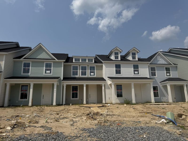 Front exterior of a new home in Abbey Walk, Moncks Corner, SC, highlighting curb appeal (Image 1).