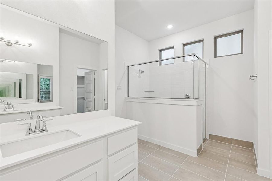 Primary Bathroom in the Picasso II home plan by Trophy Signature Homes – REPRESENTATIVE PHOTO