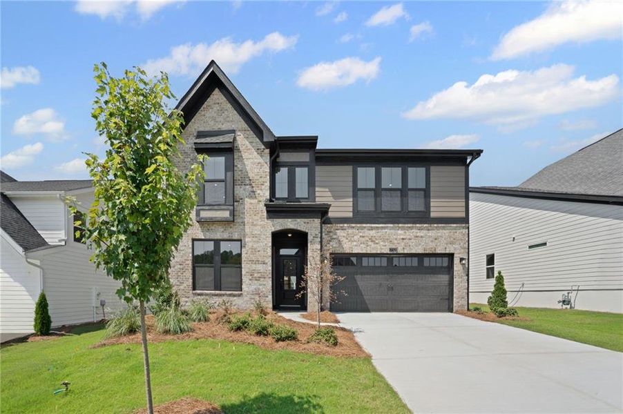 Front exterior of a new home in Twin Lakes, Hoschton, GA, highlighting curb appeal (Image 2).