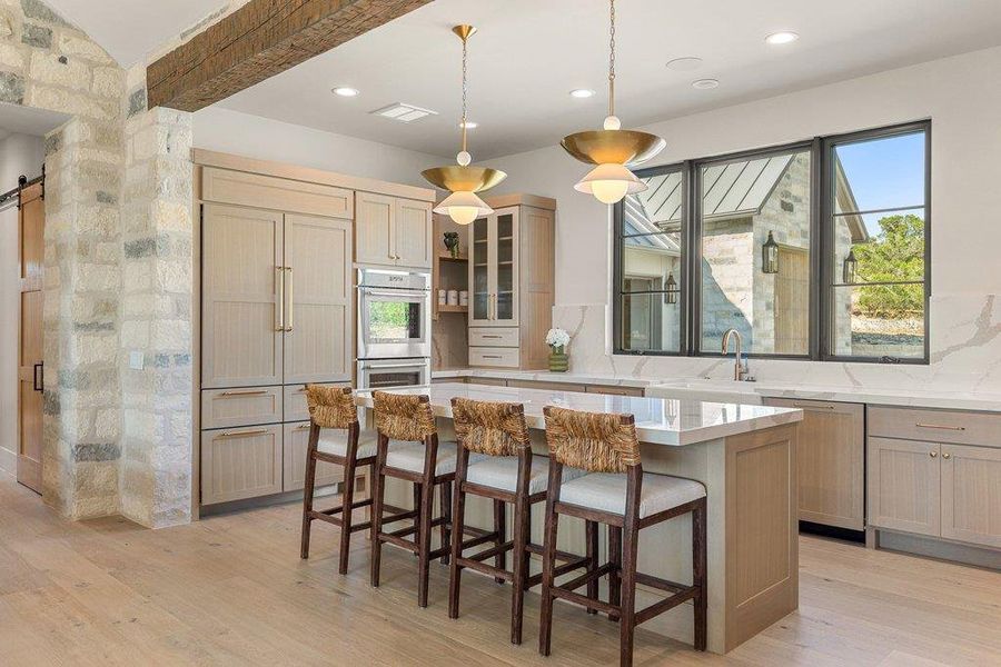 An oversized island anchors the heart of the home. An oversized island anchors the heart of the home.