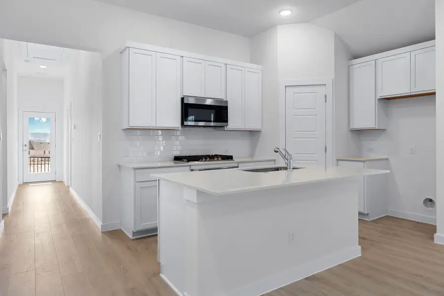 Kitchen in the Cypress home plan by Trophy Signature Homes - REPRESENTATIVE PHOTO