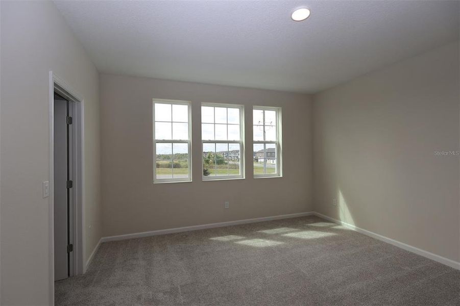 Spacious, unfurnished interior of a new home in Lake Star at Ovation, Winter Garden (Image 29).
