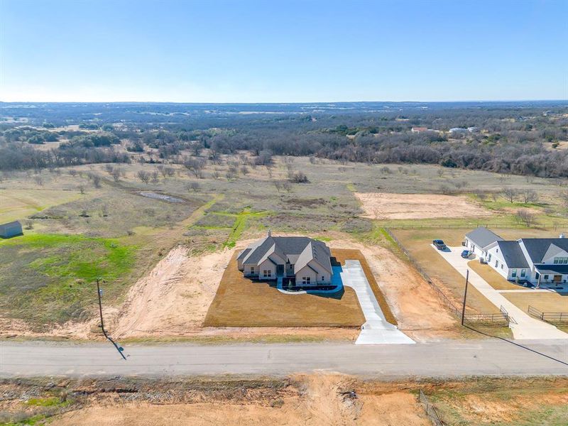 Front exterior of a new home in , Weatherford, TX, highlighting curb appeal (Image 38).