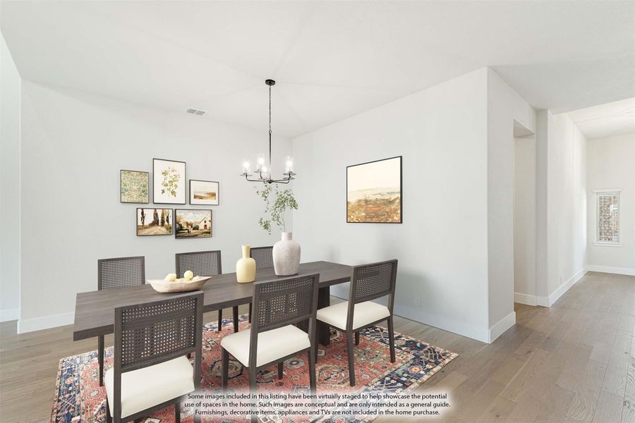 Dining room with dark wood table, cane chairs, chandelier, and hardwood floors Dining room with dark wood table, cane chairs, chandelier, and hardwood floors