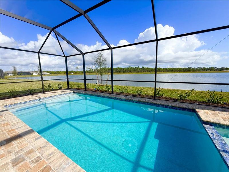 Exterior details and patio area of a home in Island Lakes at Coco Bay, Englewood (Image 8).