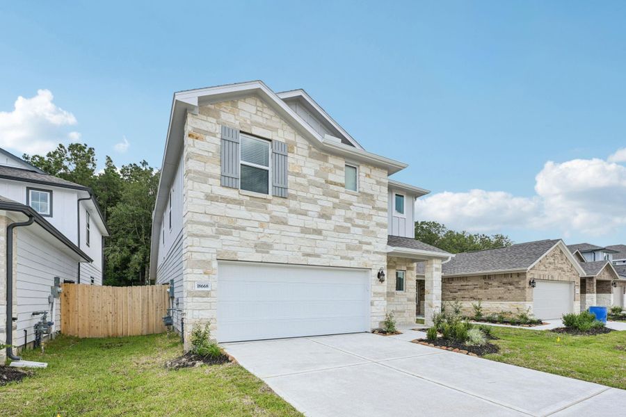 Front exterior of a new home in Landing Meadows - Traditional Series, New Caney, TX, highlighting curb appeal (Image 24).