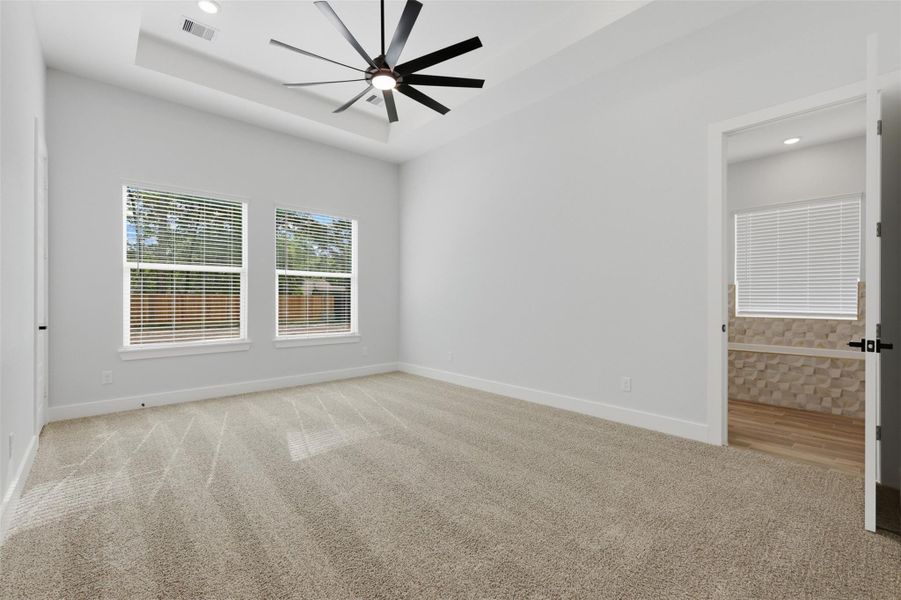 And of course the bedroom is huge! They carried the double tray ceilings into this room and added a secondary closet!