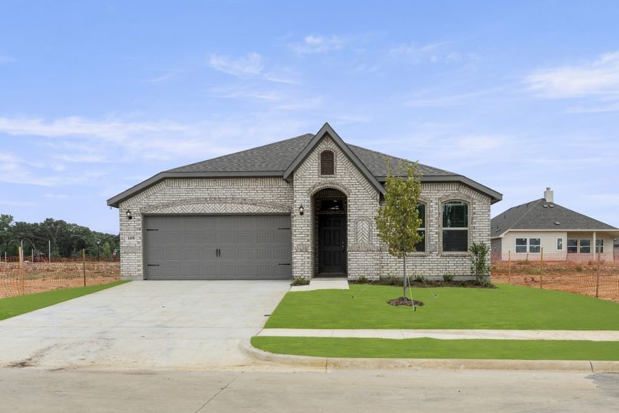 Representative exterior photo of a completed home built from the Atlanta by Impression Homes in Keeneland, Aubrey, TX (Image 1).