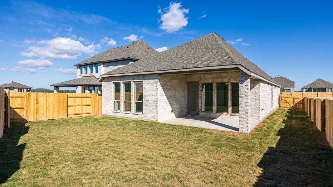 Exterior details and patio area of a home in Lariat 45', Liberty Hill (Image 2).