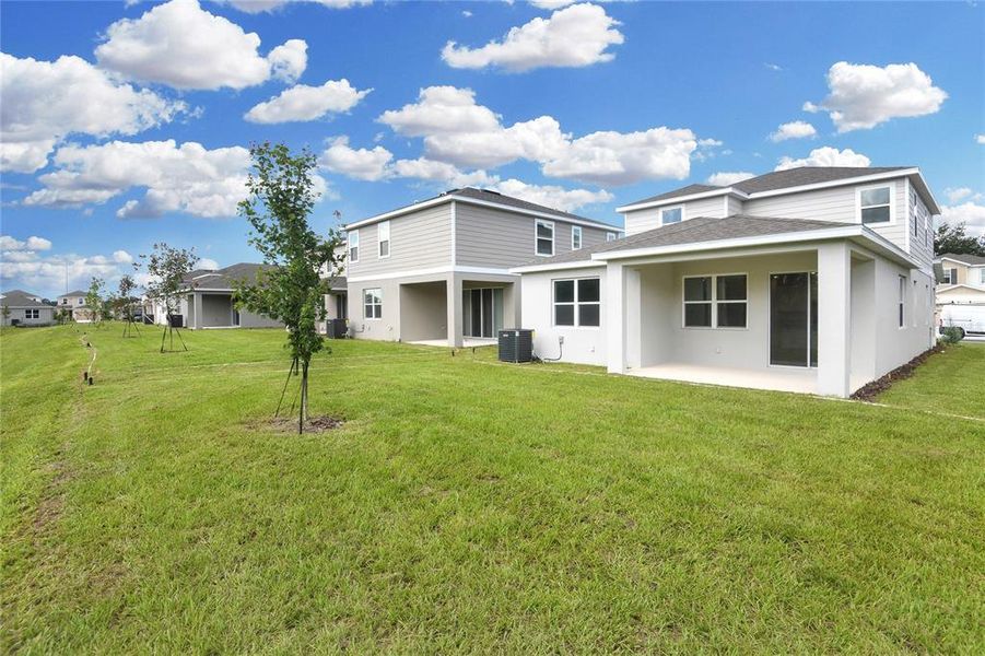 Front exterior of a new home in Seasons at Shores of Lake Dell, Dundee, FL, highlighting curb appeal (Image 1).