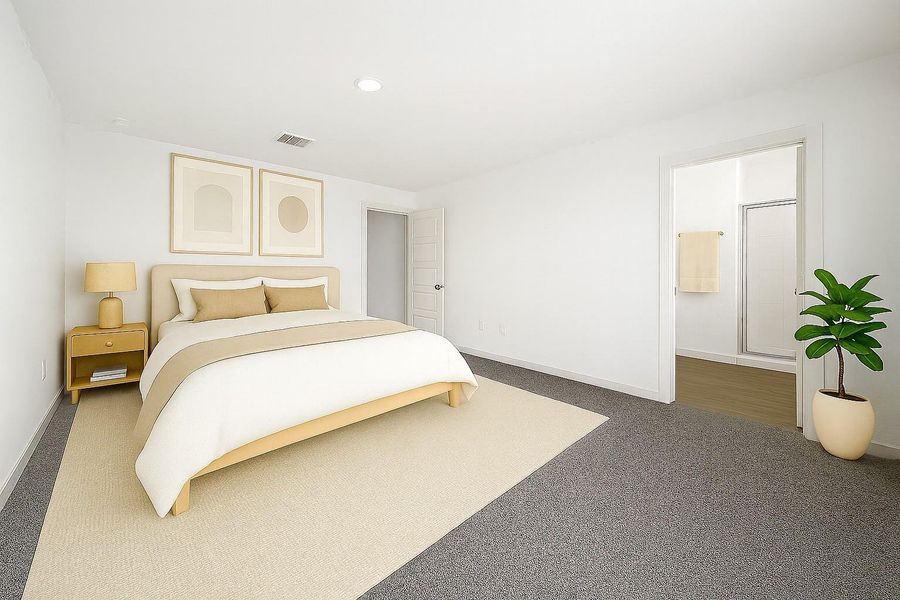 The primary bedroom is a true a retreat, offering natural light, plenty of space, and it's own en-suite bathroom. (Virtually staged).