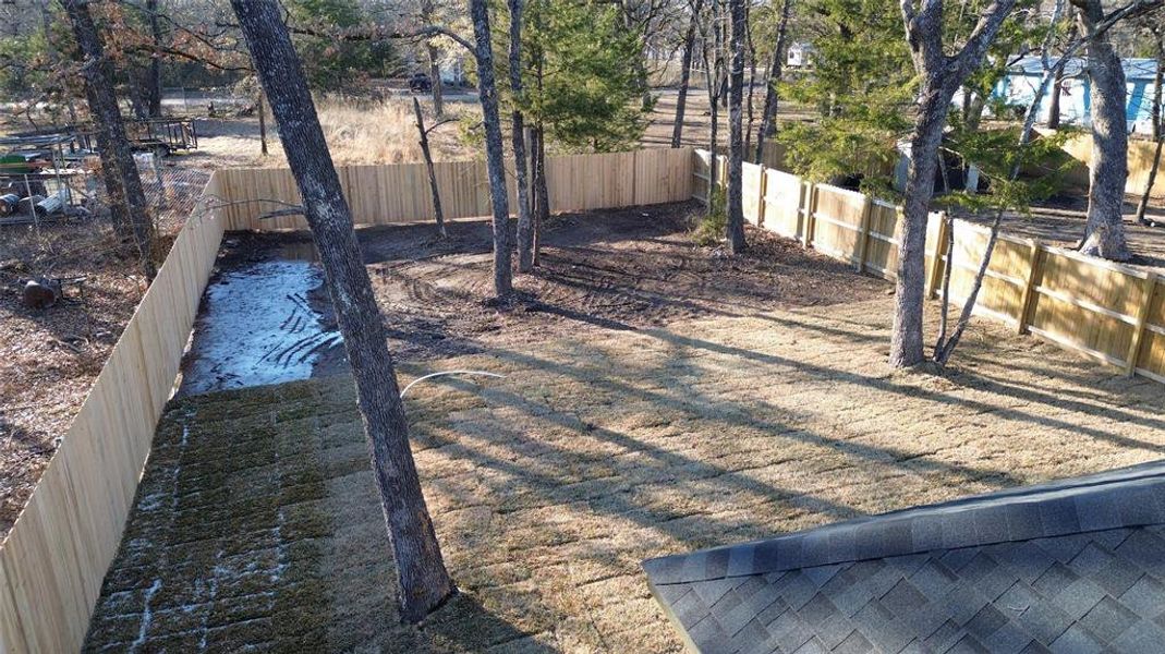 View of fenced backyard