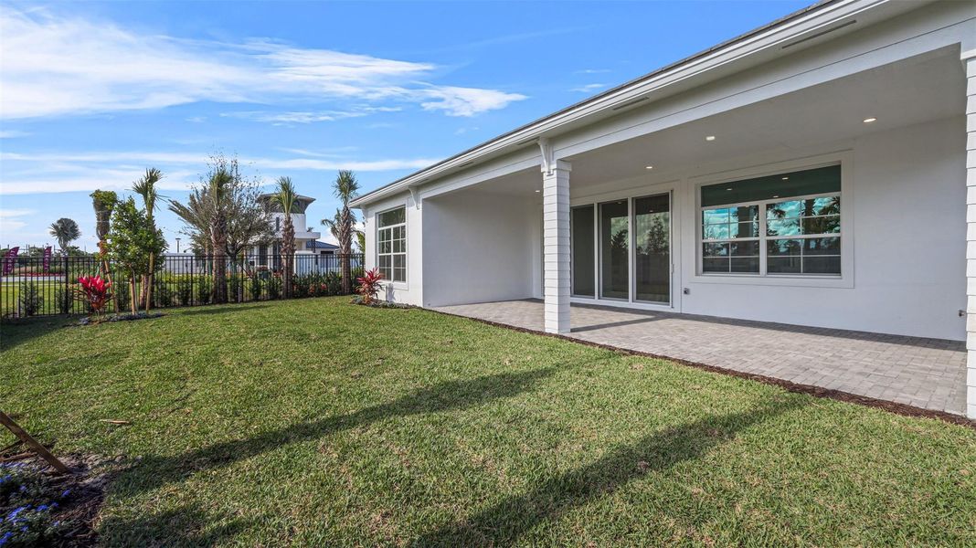 Exterior details and patio area of a home in Esprit at Avenir, Palm Beach Gardens (Image 26).