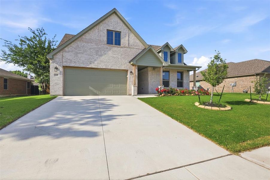 Front exterior of a new home in , Saginaw, TX, highlighting curb appeal (Image 20).